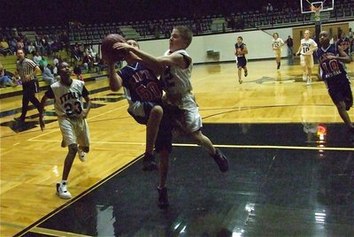 Image: J.T. protects the hoop — J.T. Escamilla(12) says, “Not in my dome!”