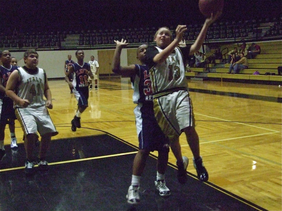 Image: Bailey fastbreaks — Walton scores on a drive to the hoop as Kevin Roldan(41) provides the backup.