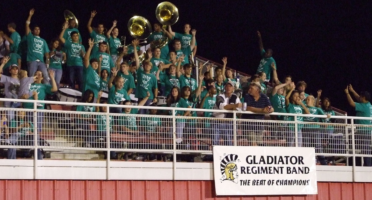 Image: 4th Quarter! — A long time tradition, everyone including the Gladiator Regiment Band holds up “4”, as the game moves into the final quarter.