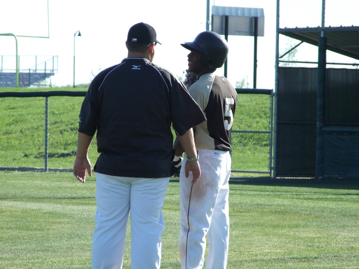 Image: Coach and Desmond — Desmond Anderson and head coach Matt Coker talk a bit before his at-bat.