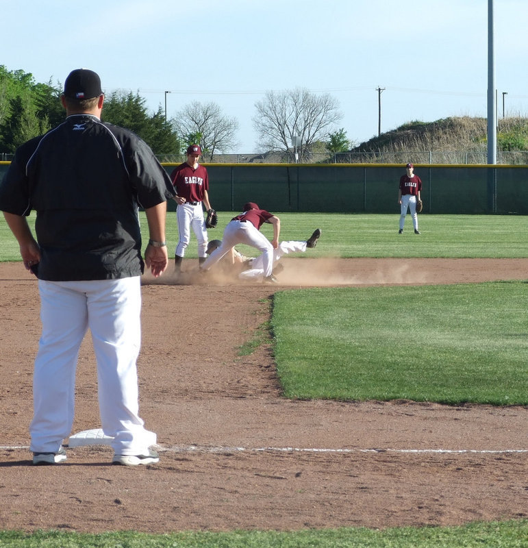 Image: A lot of action — Dan Crownover slid to second.