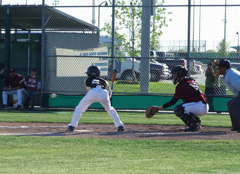 Image: Good eye — Caden Jacinto takes careful aim at this Eagle pitch.