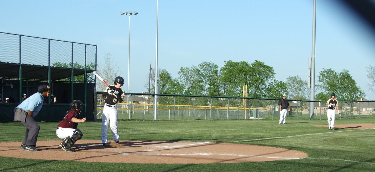 Image: Take one for the team — Justin walks to first base after a wild pitch hits his back.