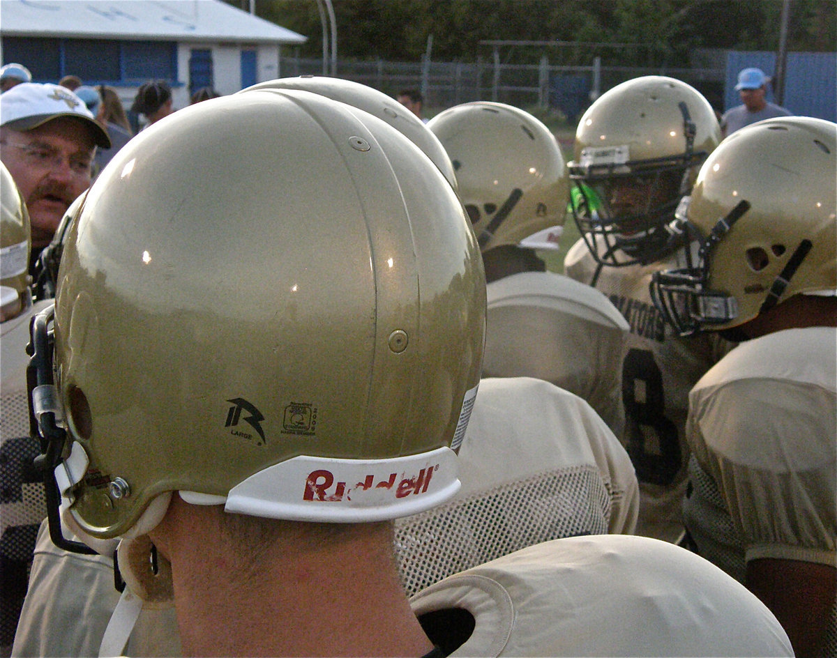 Image: Coach talks defense — Defensive Coordinator, Coach Robert Sollers, directs his soldiers.