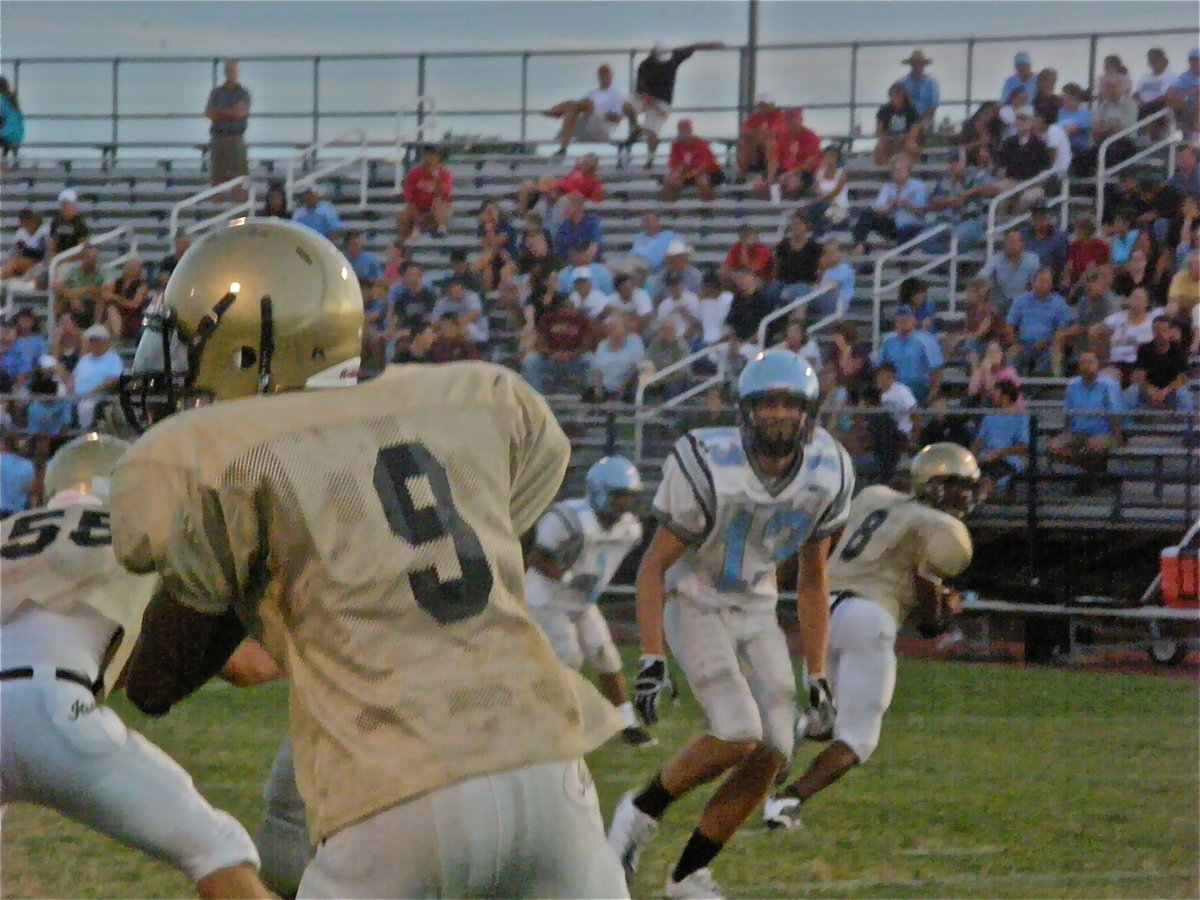 Image: Clemons drops back — Backup Quarterback, Heath Clemons, receives Jasenio Anderson’s vote for making the play of the game.