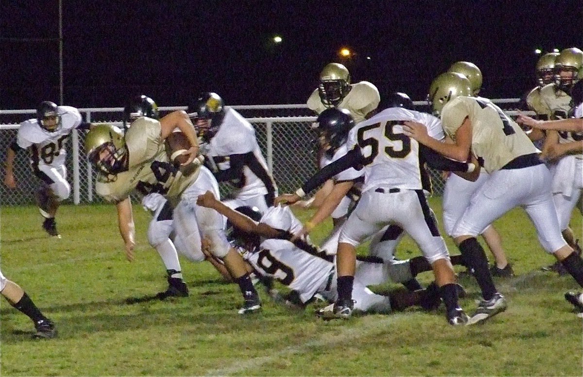 Image: Ethan Saxon(44) lunges for extra yards against Itasca — Ethan Saxon(44) rumbles and stumbles for yardage as he moves toward the goal line against Itasca. Italy’s JV took care of the Wampus Cats 32-0 on Thursday in Italy.