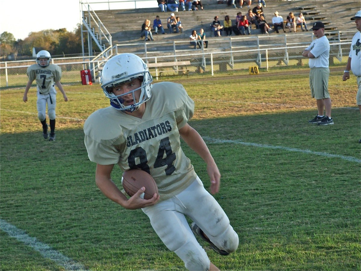 Image: Chase McGinnis(84) — J.T. Escamilla(7) completes a pass to Chase McGinnis(84) during the pre-game before the Italy Junior High played against Itasca.