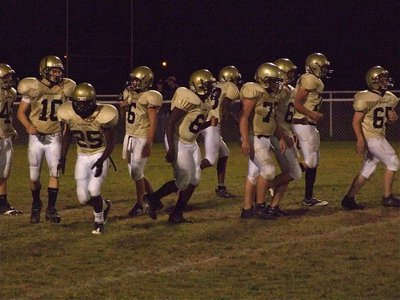 Image: The JV breaks — Breaking the huddle is Italy’s JV Gladiators as they lined up and rolled over Itasca 32-0.