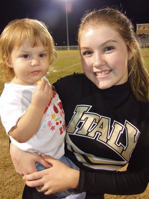 Image: Mayson and Taylor — Taylor Turner introduces 2-year old Mayson Souder during a cheer.