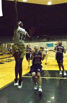 Image: Johnson can jump — Kortnei Johnson(12) scores the layup on her way to an 11-point finish.