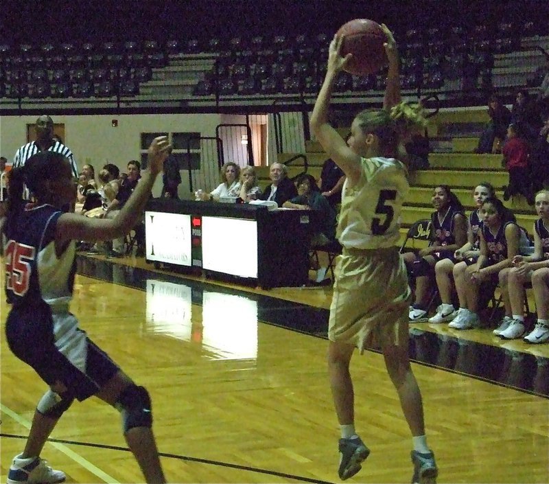 Image: Makenzie catches — Italy’s Makenzie Davis-Goodwin(5) catches a pass in front of the Lady Mustang bench.