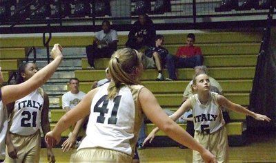 Image: Rebound that basketball — Kierra Wilson(21), Jaclynn Lewis(41) and Makenzie Davis-Goodwin(5) get ready to rebound a Lady Mustang free-throw miss.