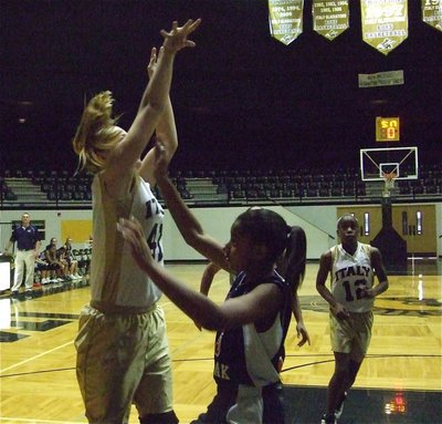 Image: Lewis lays it in — Jaclynn Lewis(41) attacks the Red Oak defense as Kortnei Johnson(12) moves in for a rebound.