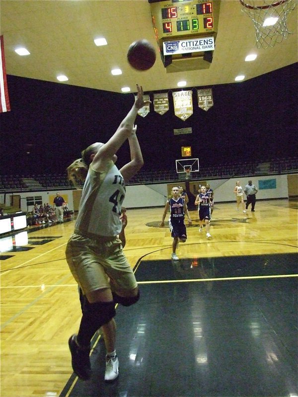 Image: A hard foul — Jaclynn Lewis(41) gets fouled on her way to the rim after a court length pass by Madison Washington.