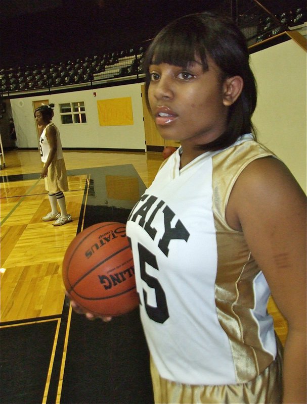 Image: Getting ready — Kendra Copeland and Ashley Harper(15) run drills to get ready for the game.