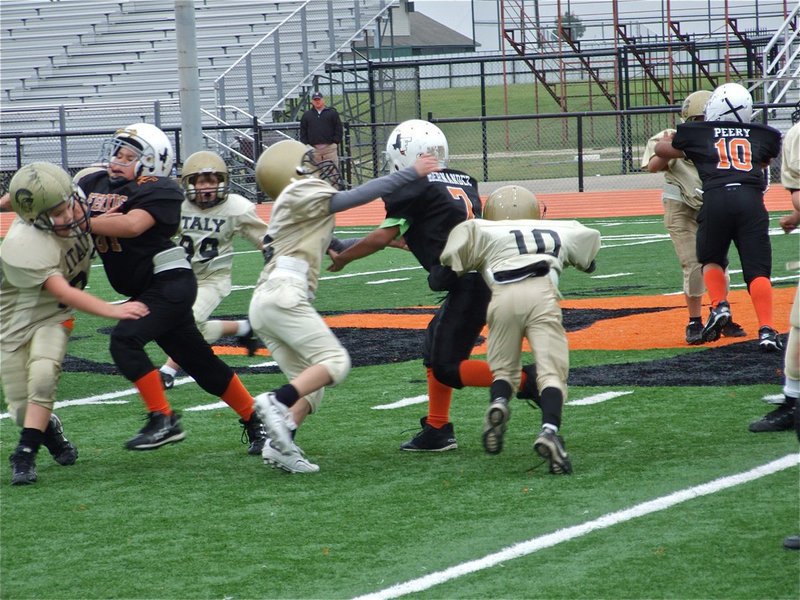 Image: It takes two — Ryder “Phat” Itson and James McIntyre(10) team up for the take down.