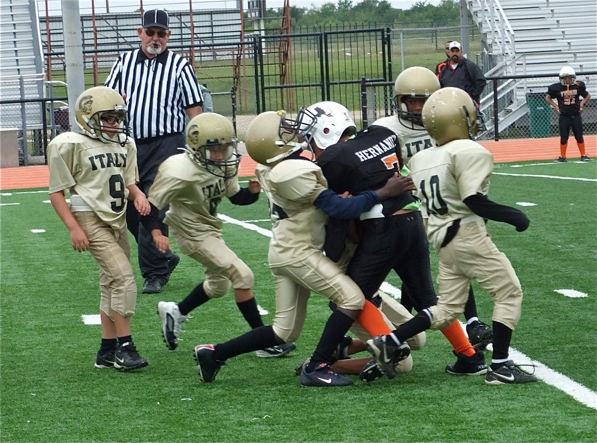 Image: Hit somebody! — The B-Team defense stung this Yellow Jacket runner with a viscous hit.