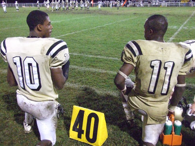 Image: Well deserved break — John Issac(10) and Jasenio Anderson(11) get a rare chance to sit back and enjoy the game from the sidelines as Italy handed Hubbard their seventh loss of the season. Isaac has scored 11 total touchdowns this season while Anderson has crossed the goal line 9 times.