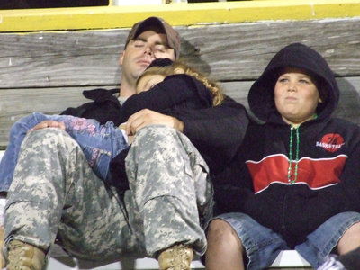 Image: Turn out the lights, the party’s over… — Justin Roberts, daughter Erin and son Cade already know the outcome of this game.