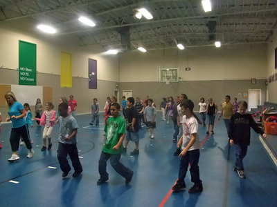 Image: Line Dancing is Fun — The students are following Mrs. Janek’s lead.