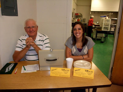 Image: Weldon Holley and Jenna Bankhead — Weldon and Jenna working hard collecting dinner tickets.