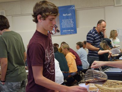 Image: Carson Hyles fills up — Carson Hyles is enjoying the meal.