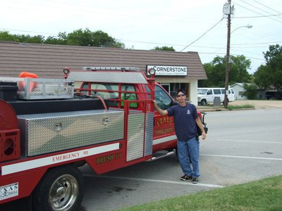 Image: Tommy Sutherland — Tommy Sutherland (volunteer firefighter for Italy) helps with the “Fill the Boot” fundraiser.