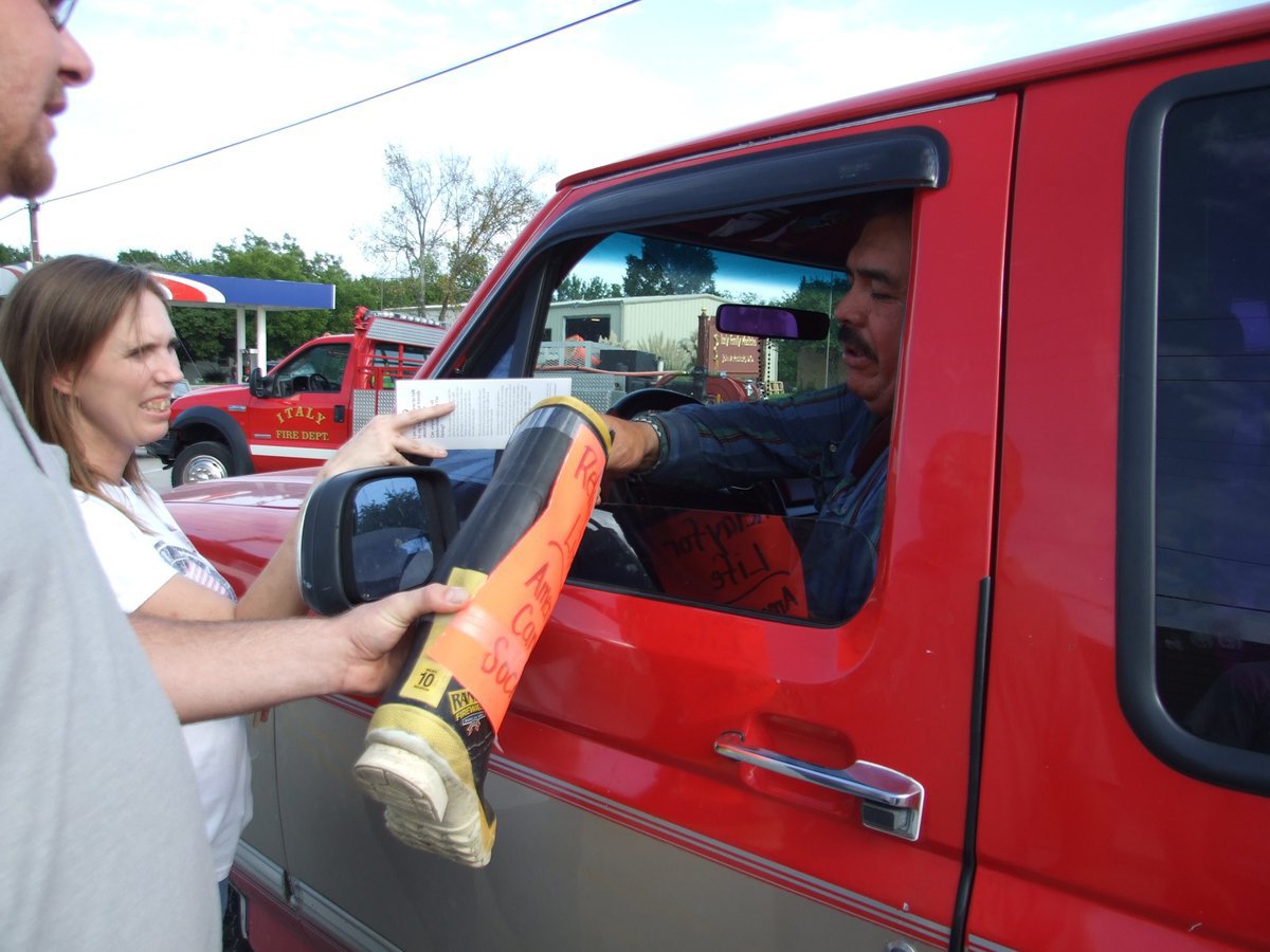 Image: Another donation — Concerned citizen stops to give money to the cause.