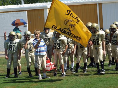 Image: A-team sports the flag — A-team sports the flag as they prepare to enter the playing field.