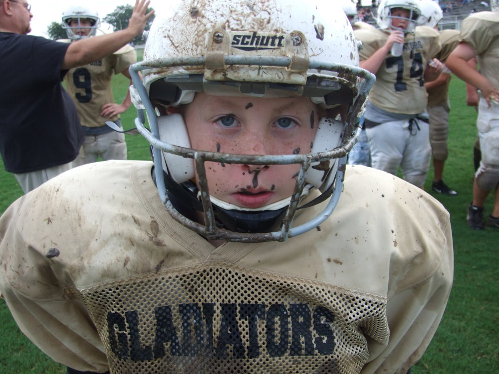 Image: Mudscamilla — Quarterback J.T. Escamilla gets a face full of mud against the Malakoff Tigers.