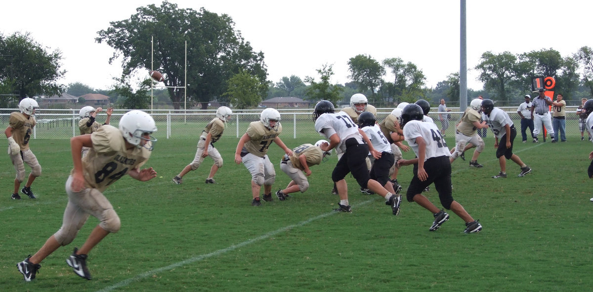 Image: It’s a snap — Chase McGinnis (84) fires off down field to try to haul in a pass from quarterback J.T. Escamilla.