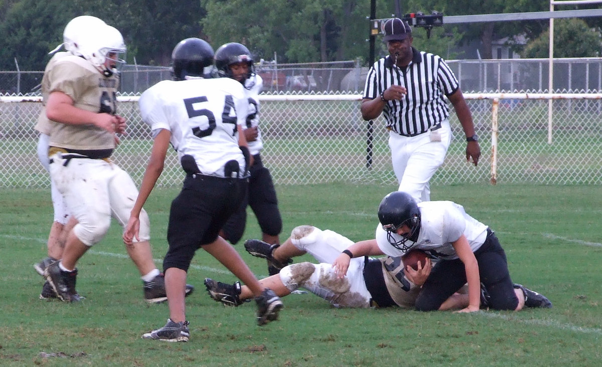 Image: Tigers in trouble — Zain Byers (25) brings down a Tiger.