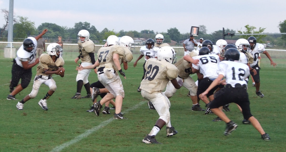 Image: Flash of lightning — Eric “Flash” Carson looks for a running lane against the Tigers in the 8th Grade game.