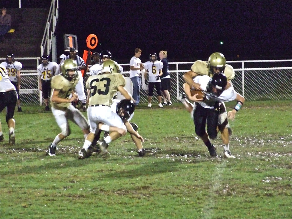 Image: Jackson attacks — Kyle Jackson (28) tracks the Tiger quarterback from behind.