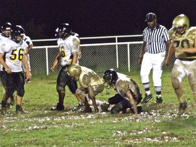 Image: Mudding — Italy’s JV and their high powered offense bogged down against Malakoff who came from behind to win 34-18.