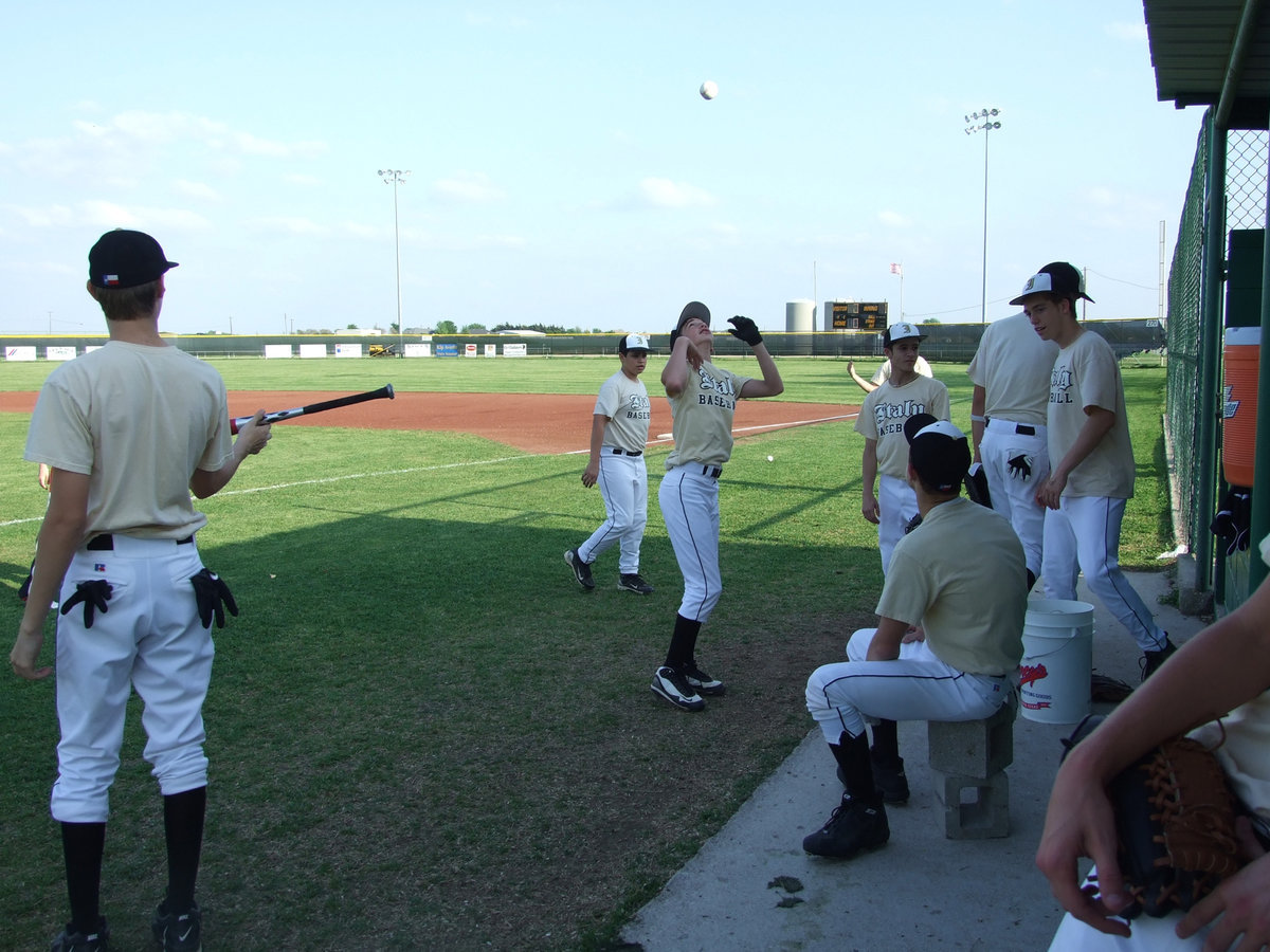 Image: Just playin’ around — The Gladiators are warmed up and waiting on the Mustangs to do the same.