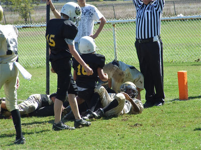 Image: Pile up at the pylon — Hubbard crosses the goal line against the IYAA  A-Team…barely.