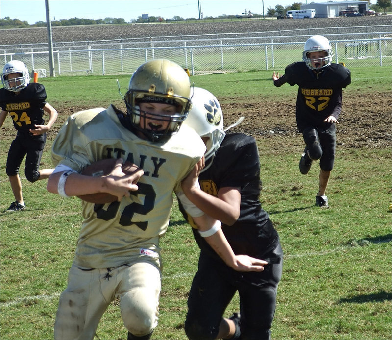 Image: Maynard scrambles — Austin Maynard advances the ball down the sideline.