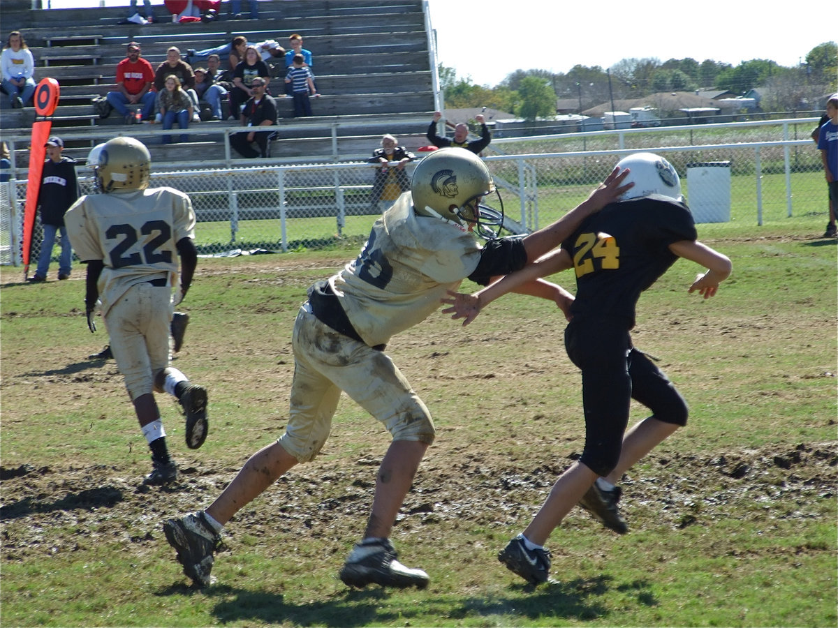 Image: 110% Effort — Joseph Celis gets a kick-out block for the A-Team.