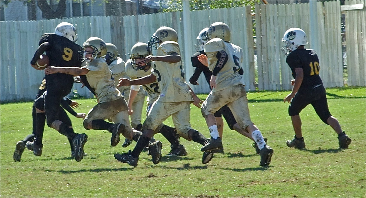 Image: This is our yard! — The Jaguars get greeted by a host of angry Gladiators when Hubbard knocked on the front door of Italy’s endzone.