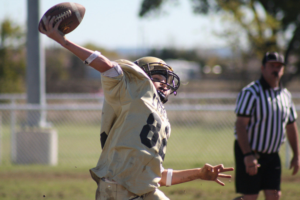 Image: Maynard to pass — Austin Maynard launches a deep pass over the Hubbard defense. This photo was courtesy of Michele Maynard and you are invited to view more of her pics of the A-Team’s game against Hubbard at: www.michelemillerphotos.com