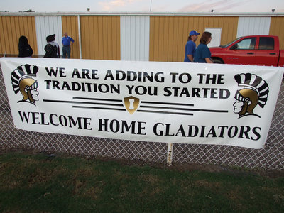 Image: Italy High School welcomes home past graduates — Friday was Homecoming for Italy High School. The classes that graduated in years ending in “9” were celebrated and remembered. The banner above was one of three banners donated by Monolithic Constructors, Inc. with local artist Barry Byers applying the graphics.