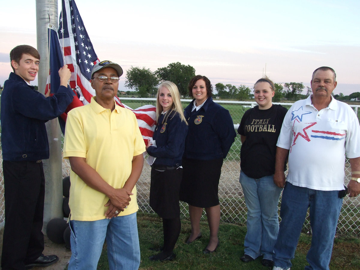 Image: Veterans honored — In a flag raising ceremony before the game, Billy Copeland and Clifford Daniels were honored as veterans.