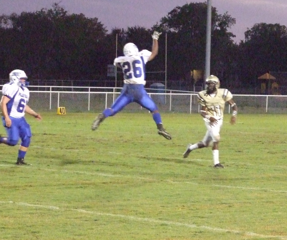 Image: When Lions fly… — This Frost Polar Bears tried to keep pressure on Italy quarterback, Jasenio Anderson, but the “Beast” passed for 3-touchdowns in the 1st half.