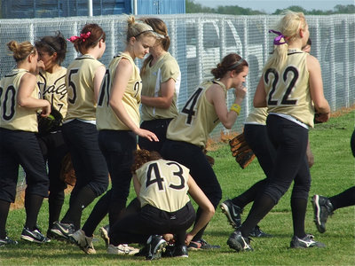 Image: Taking the field — The Lady Gladiators charge onto the field. Well, almost all of them.