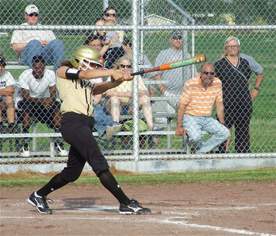 Image: Proper technique — Anna Viers(43) squashes the bug with her back foot and rotates her hips toward the pitcher to hit the ball with maximum power.