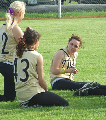 Image: Enjoying the win — Megan Richards, Anna Viers and Drew Windham relax after the 14-0 win over Frost.