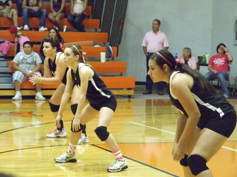 Image: Molly, Drew and Alyssa — The back row awaits the next play.