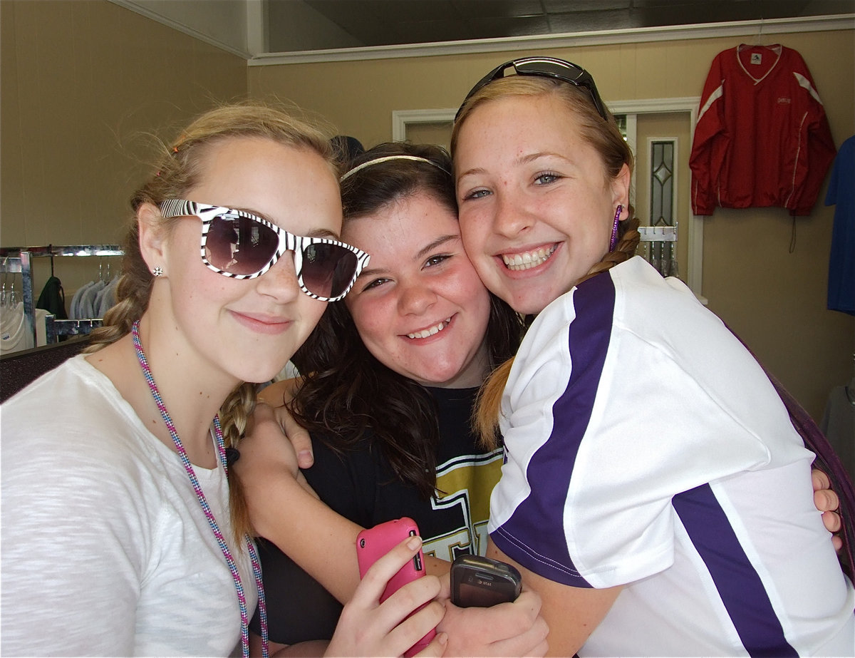 Image: Enjoying the event — Athletes Kelsey Nelson, Bailey DeBorde and Jaclynn Lewis are enjoying the Game On Athletics grand opening.