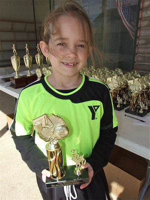 Image: Karley Nelson — Karley Nelson receives her IYAA trophy and then checks out the new Game On Athletics print shop.